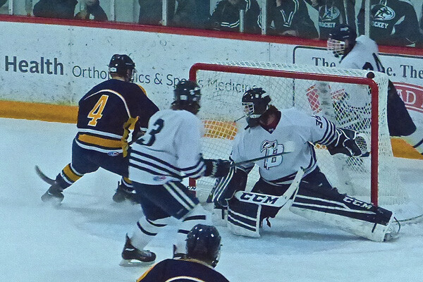Hockey takes over where Vikings have faltered: Hermantown’s Matt Valure (4) cut past the net after failing to score early in the Hawks’ opening 4-0 Hilltopper Classic tournament game against Bemidji. Final in the tournament will be Thursday afternoon. Photo credit: John Gilbert