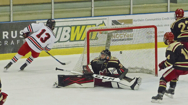 Maple Grove freshman goalie Ethan Haider deflected a shot by East's Alex Robb behind the net, among his 40 saves. Photo credit: John Gilbert