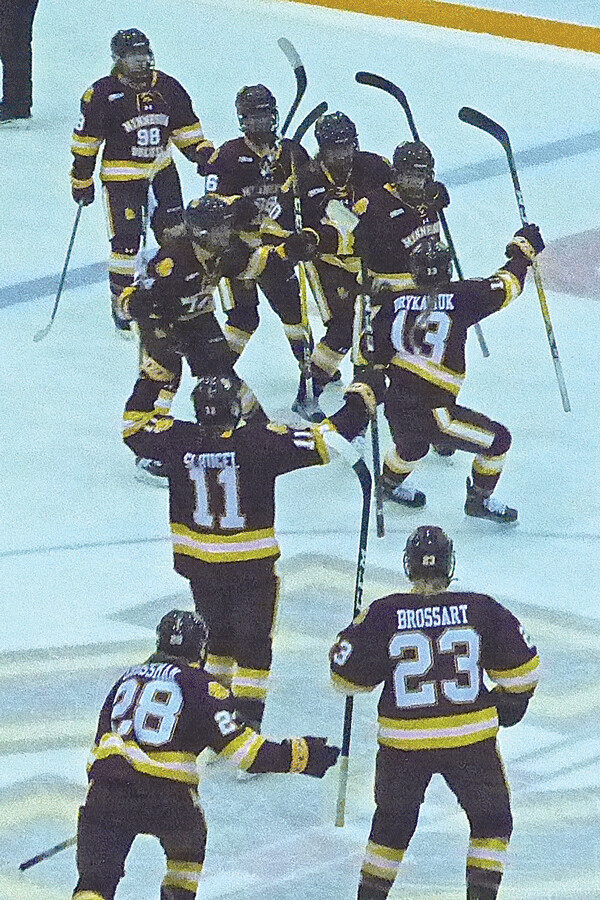 Exhausted or not, the UMD women poured onto Ridder Arena's ice after the 2-1 double-OT victory over Minnesota in the WCHA semifinals. Photo credit: John Gilbert