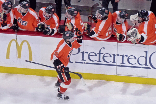Thunderhawks Gavin Hain high-fived the bench after scoring a hat trick in the 6-3 victory over Moorhead in the state Class AA final.