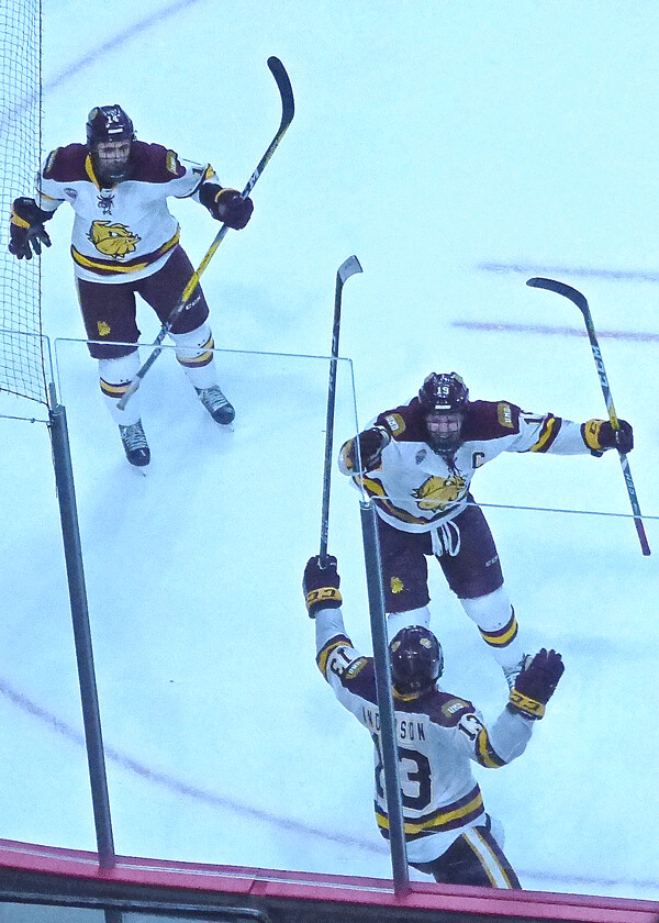 The three linemates celebrated the goal that gave UMD its first Frozen Faceoff tournament championship. Photo credit: John Gilbert