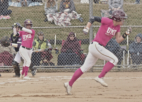 UMD’s Hannah Schmoll bolted from first base and scored on Natalie Wright’s bases-loaded triple to ignite a 6-run third-inning rally. UMD won 8-5 after a 4-0 opening loss to Minnesota State-Mankato. Photo credit: John Gilbert