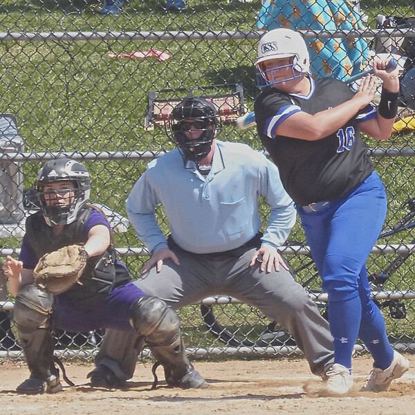 When she wasn't pitching, Chrisi Mizera swung the bat with authority, including three home runs in St. Scholastica's three victories. Photo credit: John Gilbert