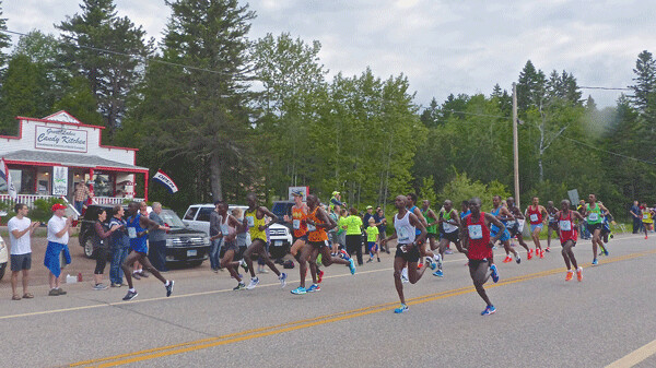 Ultimate winner Geoffrey Bundi, far left No. 1) set the pace for a lead group of 19 runners into Knife River. Photo credit: John Gilbert