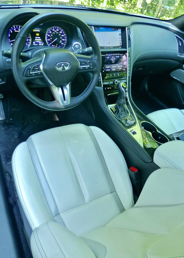 White leather contrasts with the Iridium Blue of the Q60 3.0t. Photo credit: John Gilbert