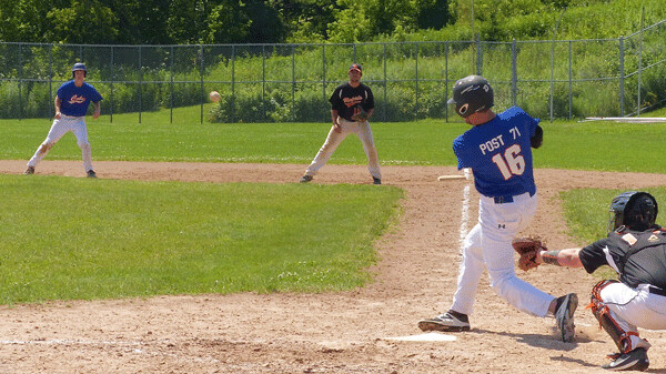 Rallying from an 11-4 deficit, West Duluth Cubs second baseman Maddux Baggs connected with a Grand Rapids pitch... Photo credit: John Gilbert