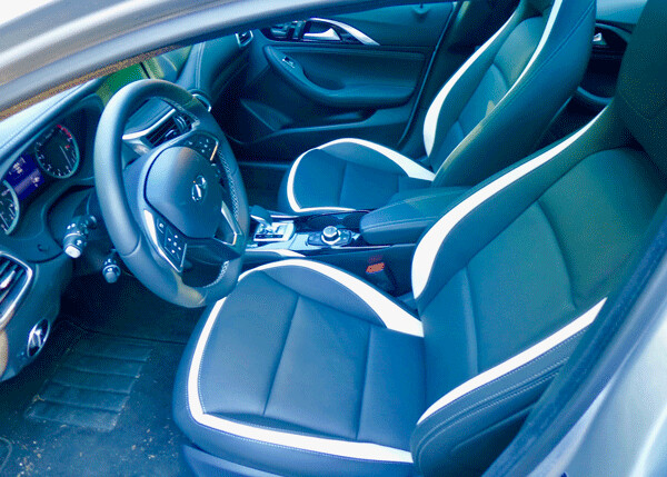 Infiniti QX30 interior is filled with leather luxury and technical gizmos. Photo credit: John Gilbert