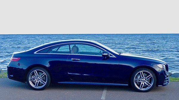 The Mercedes-Benz E400 4Matic Coupe tries to out-blue Lake Superior - a tough chore. Photo credit: John Gilbert