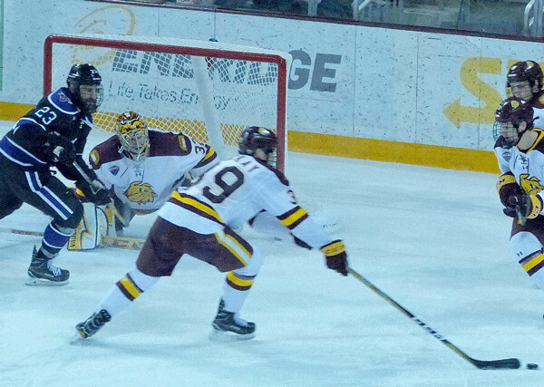 Winger Parker Mackay’s timely backcheck reached the puck to help out UMD goalie Hunter Shepard, who beat MSU-Mankato 3-1. Photo credit: John Gilbert