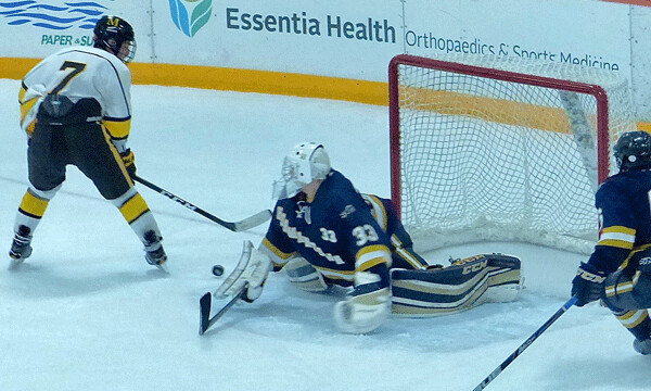 Hermantown goaltender Cole Manahan stopped a late breakaway by Marshall’s George Grannis. Photo credit: John Gilbert