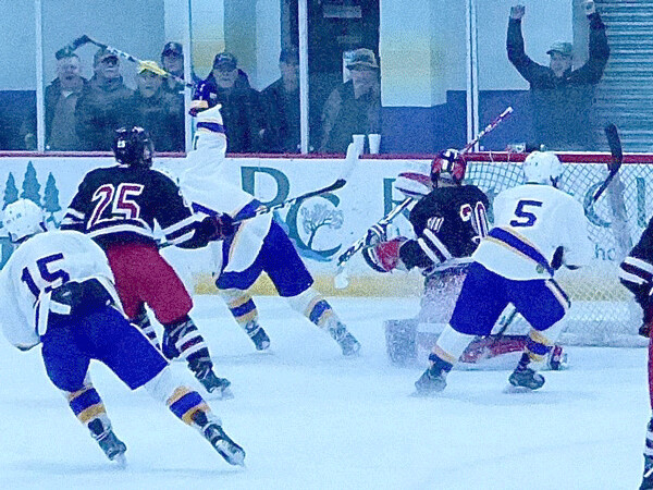 Cloquet-Esko-Carlton’s Branden Matteen (11) peeled off signalling his goal, which gave the Lumberjacks an improbable 6-5 lead over Duluth East with less than 16 seconds remaining. Photo credit: John Gilbert