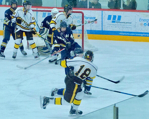 Marshall junior defenseman Peter Hansen rifled a power-play shot from the right point that found the Hermantown net for a 3-1 lead. Photo credit: John Gilbert