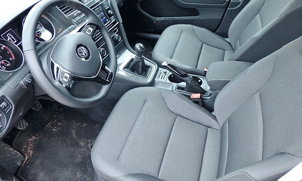 Plain but attractive interior includes supportive bucket seats and smooth-shifting manual. Photo credit: John Gilbert