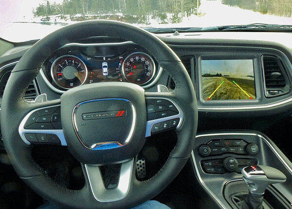 Shift paddles adorn the Challenger GT steering wheel, and full instrumentation with a nav system complement the driver’s view. Photo credit: John Gilbert