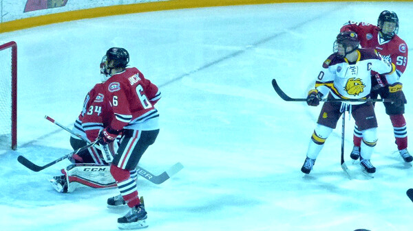 UMD captain Karson Kuhlman hot his stick on Louie Roehl’s point shot for a deflection goal and an early 1-0 lead over St. Cloud Friday. Photo credit: John Gilbert