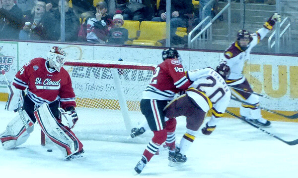 Karson Kuhlman knew he was going to get knocked down, but he stood his ground until he was sure his short-handed goal was in for a 5-0 second-period lead. Photo credit: John Gilbert