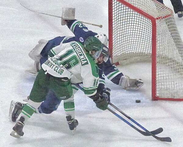 ..The puck ended up against the goalie's glove, right on the goal line, and the officials ruled no goal. Photo credit: John Gilbert