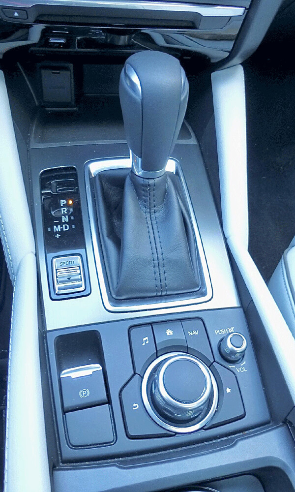 Console controls feature a switch to allow sportier handling and performance. Photo credit: John Gilbert