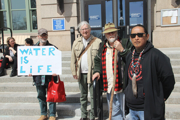 Activists at the St. Louis County Courthouse April 20, where three activists had a hearing for their actions at Wells Fargo in January. From left, Greg Boertje-Obed and defendants Michael Niemi, Scott Bol and Ernesto Burbank. (Photo by Richard Thomas)