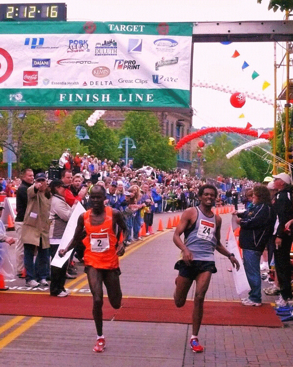 At the finish of the 2011 Grandma's Marathon, Kenya's Christopher Kipyego, left, said he was uncertain he had beaten Ethiopia's Teklu Deneke, to win the race. Photo credit: John Gilbert