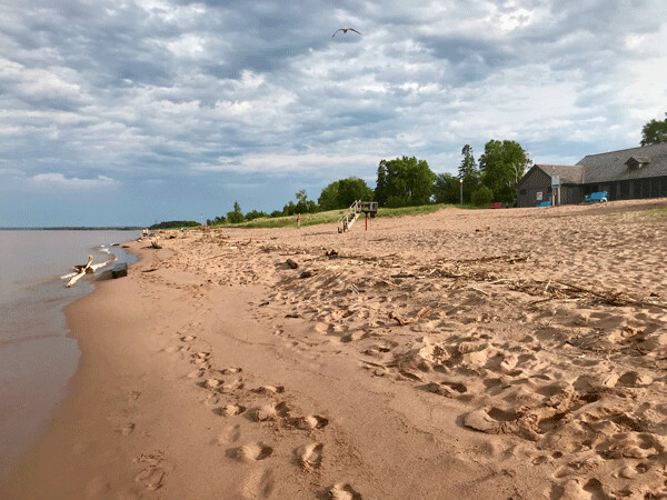 Chunks Of tree branches and all manner of debris have befouled the miles of sandy beach that makes Park Point a tourist attraction. Photo credits: John Gilbert