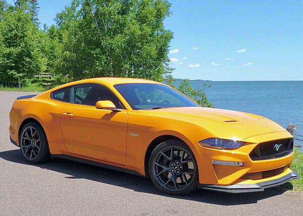 Ford Mustang GT revised, with more power, handling modes, and a yellow-orange that would make any school bus stand out. Photo by: John Gilbert