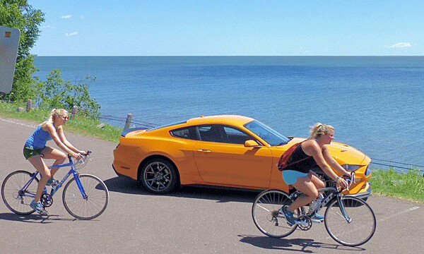 Photo stop on Lake Superior’s North Shore allowed me to recommend Great Lakes Candy shop to a couple of bike-riding cousins who are UMD alumni. Photo by: John Gilbert