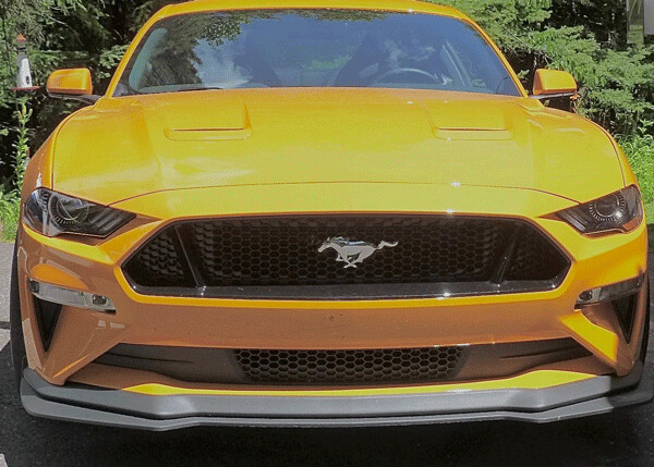 The galloping Mustang races across the grille on the menacing look of the GT’s front  end. Photo by: John Gilbert
