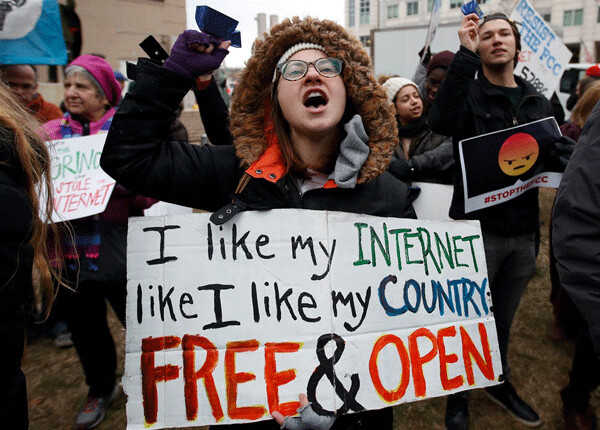 Protesters rally outside the FCC headquarters before the vote. Photo: Carolyn Kaster / AP