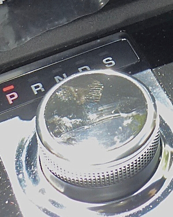 Puck-shaped control rises out of the console for shifting gears. Photo credit: John Gilbert