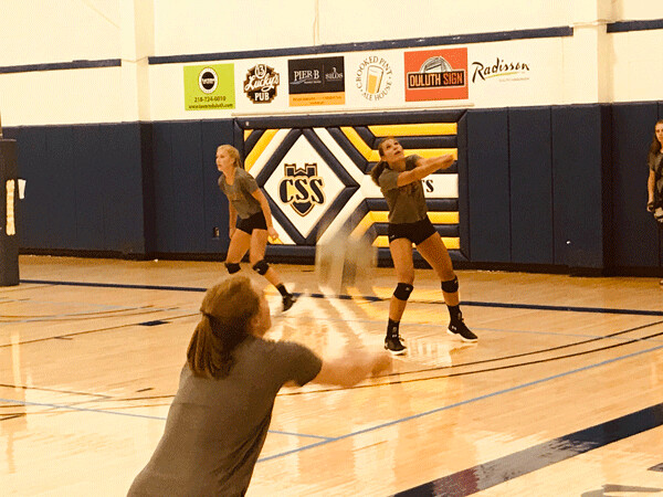 UMD volleyball players worked on setting up teammates at St. Scholastica’s Reif Gym. Photo credit: John Gilbert
