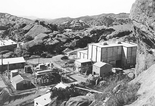 In 1959, a partial reactor meltdown struck the Sodium Reactor Experiment at the Santa Susana Field Laboratory (pictured), in the Simi Hills 30 miles from Los Angeles, CA. The incident was successfully kept secret until 1979. According to the 1997 “Epidemiologic Study to Determine Possible Adverse Effects,” Santa Susana Field Lab workers showed higher than expected rates of some cancers. Dept. of Energy photo.