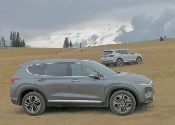 A pair of 2019 Santa Fe test vehicles paused in the Utah mountains. Photo credit: John Gilbert