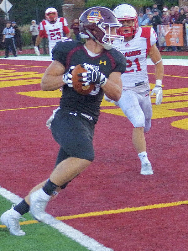 ...for his third touchdown pass and a 36-0 halftime lead. Photo credit: John Gilbert