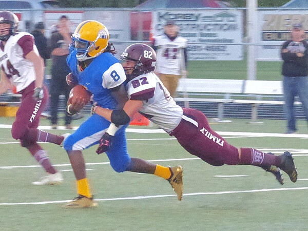 Mason Meyer of Two Harbors stopped Esko's Kevin Gregory III with a flying tackle. Photo credit: John Gilbert