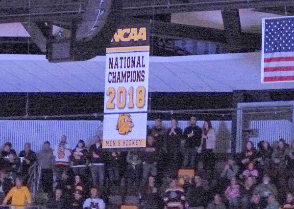 Speeches, tribute videos, and finally the pregame unveiling of the NCAA championship banner at AMSOIL Arena. Photo credit: John Gilbert