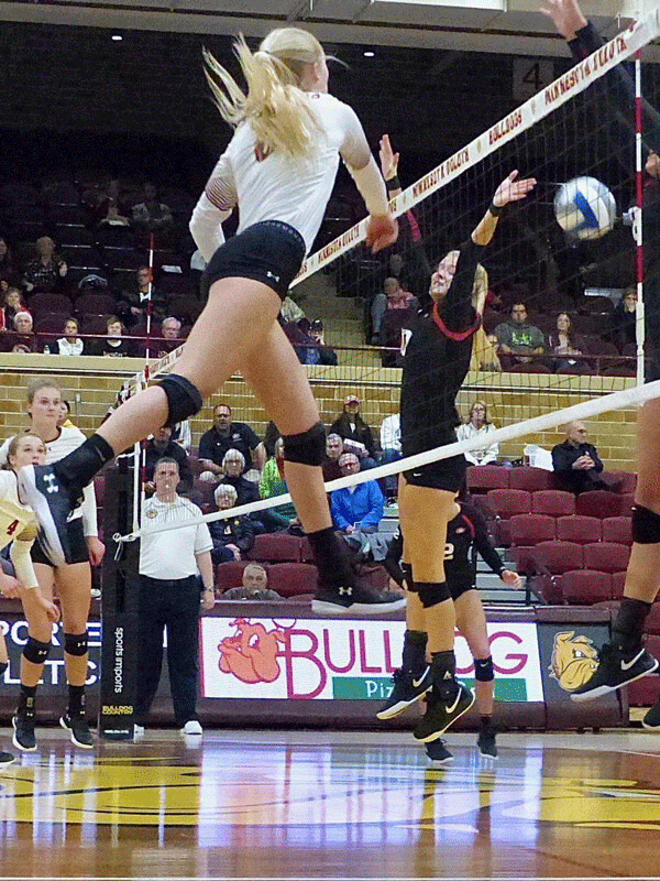 Hanna Meyer flew high at Romano Gym to blast one of her 13 kills for the Bulldogs in their first-game victory over St. Cloud State. Photo credit: John Gilbert