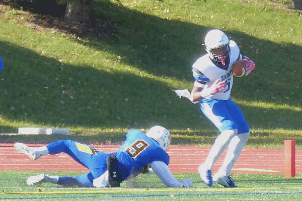 Thomas More's Da'marco Canty caught a 39-yard touchdown pass, his second of the game, in a 35-0 drubbing of Saint Scholastica in a battle of Saints last Saturday at Public Schools Stadium. Photo credit: John Gilbert