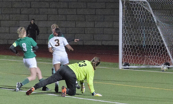 Marshall's Baamlak Haugen (3) danced around Chisago Lakes goaltender Dylan Grave and scored her second goal of a 4-0 7A final victory. Photo credit: John Gilbert