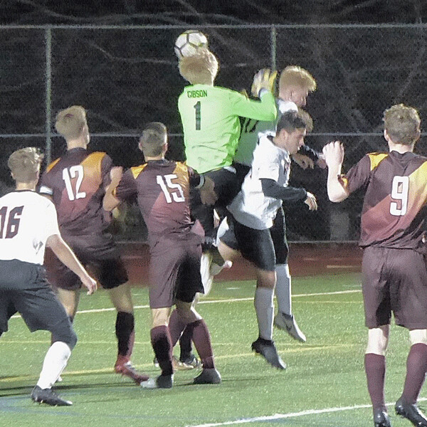 Denfeld goalkeeper Eric Gibson cleared the ball from danger with a header in the Hunters' 3-0 Section 7A soccer victory over Grand Rapids. Photo credit: John Gilbert