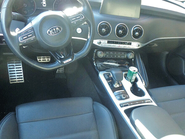 Flat-bottom steering wheel and all sorts of specialty switchwork dominates the driver's position in the Stinger. Photo credit: John Gilbert