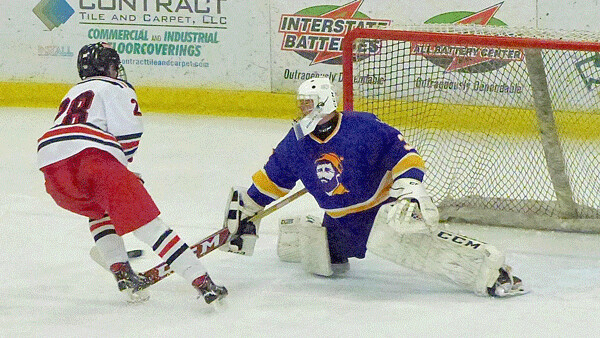 Duluth East’s Logan Anderson came out of the penalty box, caught a 90-foot pass from Frederick Paine, and raced in to score on Cloquet-Esko-Carlton goaltender Owen Carlson at 0:45 of overtime for a -1 victory. Photo credit: John Gilbert