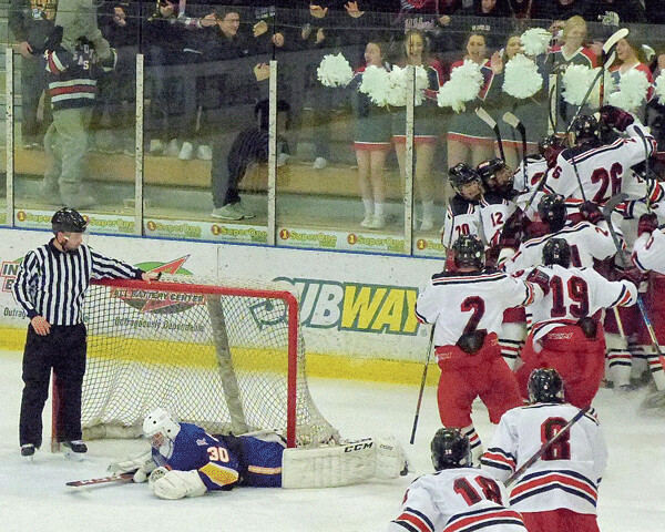 The entire East team poured off the bench to mob Logan Anderson in front of the East cheering section after his overtime game-winner. Photo credit: John Gilbert