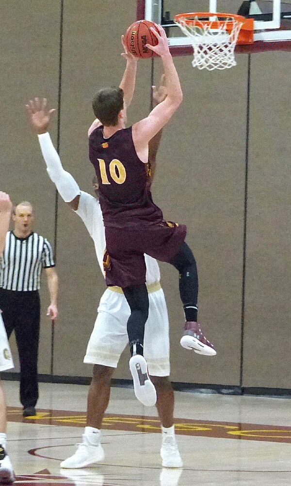 UMD junior Brandon Myer (10) went up to score two of his 29 points in UMD's 75-63 loss to Southwest Minnesota State Saturday. Photo credit: John Gilbert