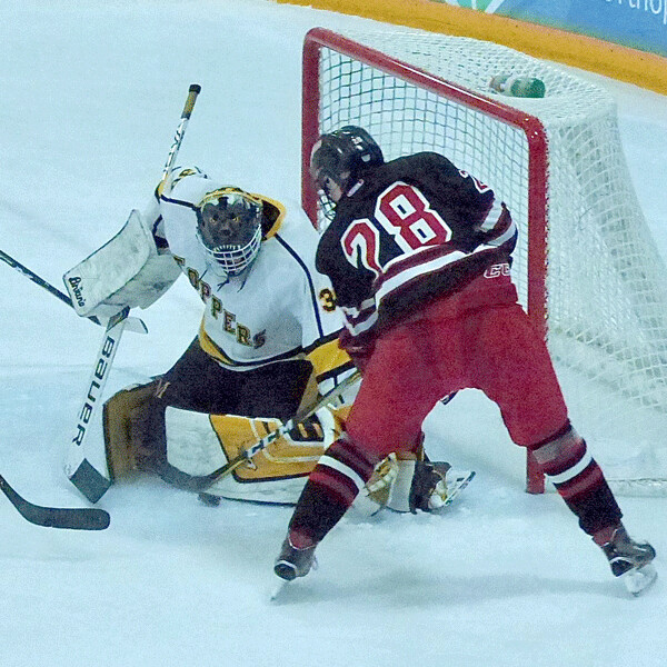 Marshall goaltender Alex Busick faced a 54-shot barrage from Duluth East’s gunner in an 8-2 setback, but he made one of his 48 saves on Duluth East’s Logan Anderson, who had a goal and three assists. Photo credit: John Gilbert