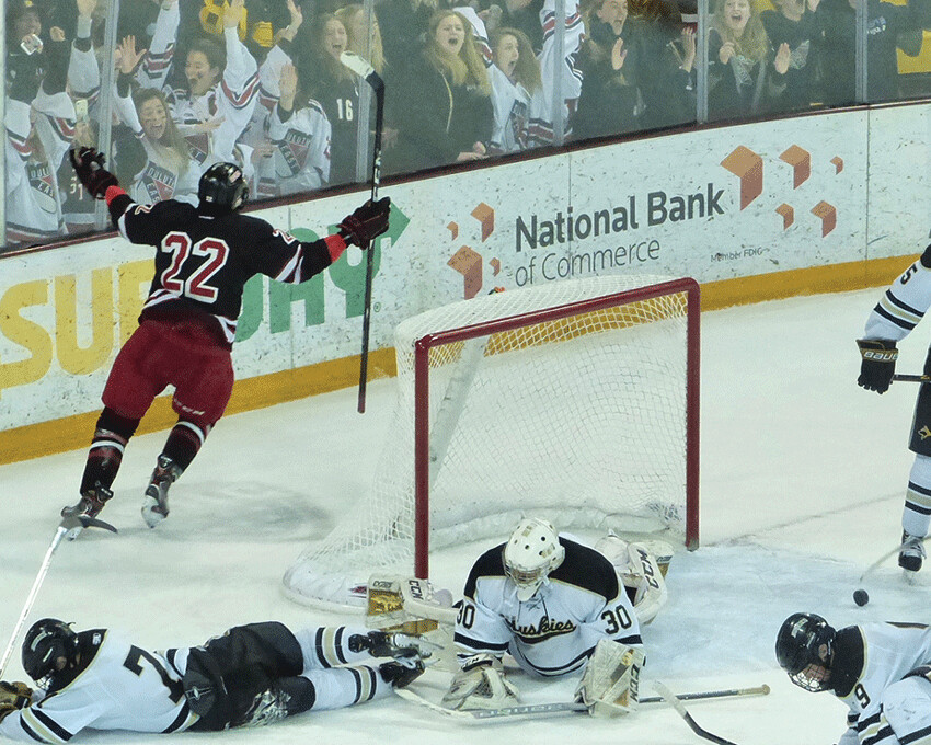 Duluth East's Mr. Hockey candidate Ryder Donovan raises his hands after scoring over the diving Ben Fritsinger for the winning goal in overtime against Andover in the 7AA final. Photo credit: John Gilbert