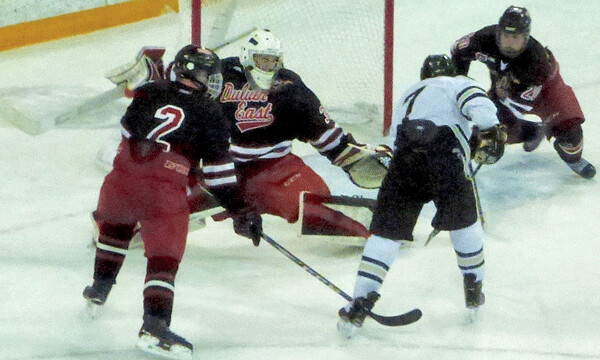 East goalie Brody Rabold snatched Luke Kron's point=blank shot East defeneman Frederick Paine (right) was diving in behind his goalie with 3 seconds remaining in regulation.
