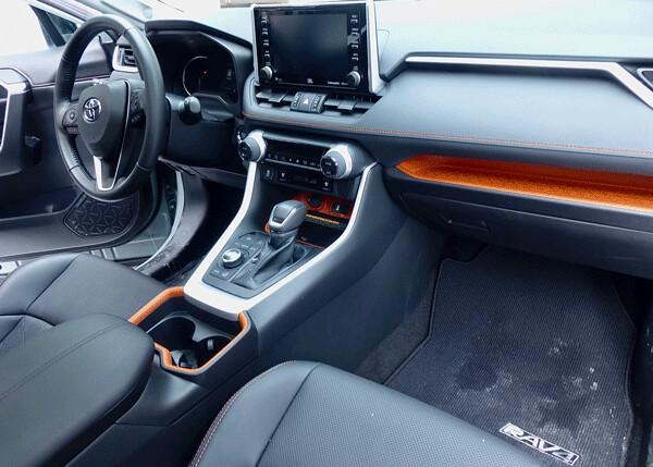 Tastefully done, orange trim raises interior to contemporary level and sets off  all sorts of upgrades. Photo credit: John Gilbert