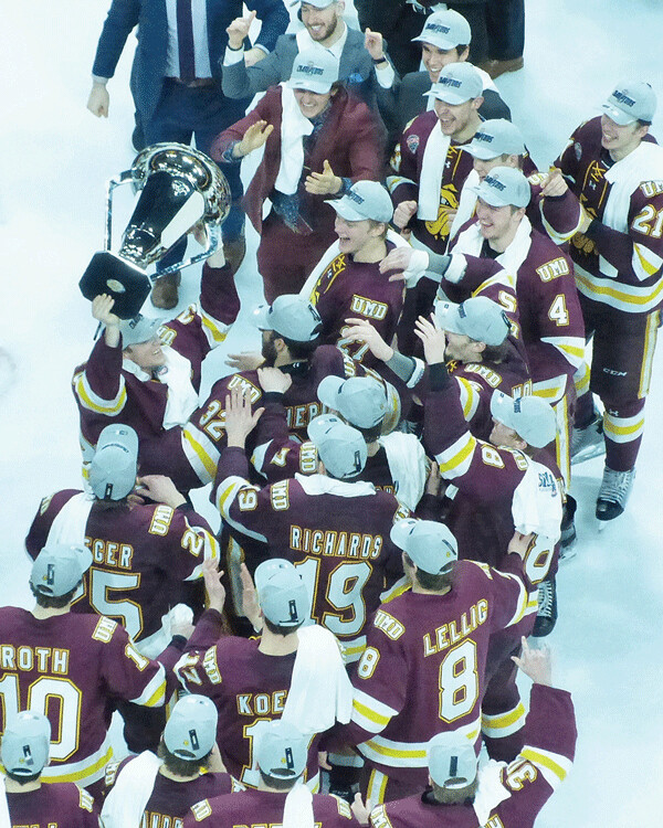 UMD captain Parker Mackay delivered the NCHC Frozen Faceoff trophy to his teammates at the victory ceremony at Xcel Center. Photo credit: John Gilbert