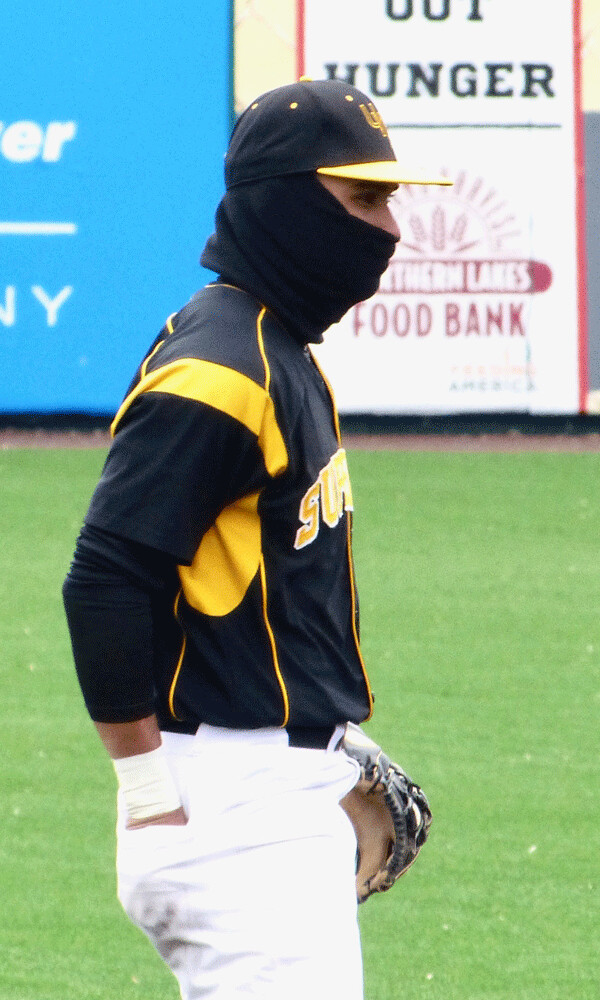 UWS shortstop Jordan Berrios was set for cold weather, although he probably couldn’t have gotten through airport security. Photo credit: John Gilbert